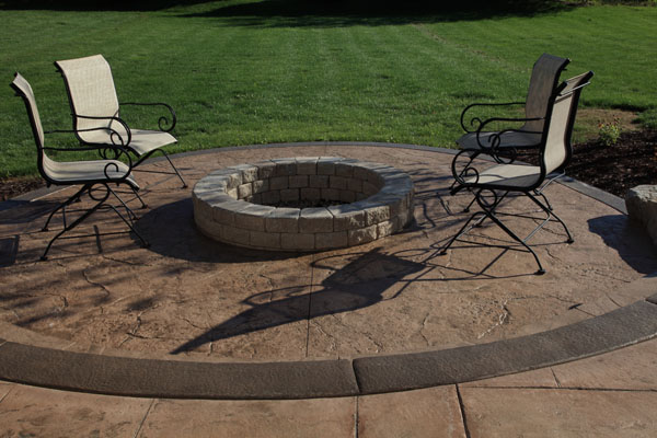 Old Granite Textured Patio with Built in Firepit
